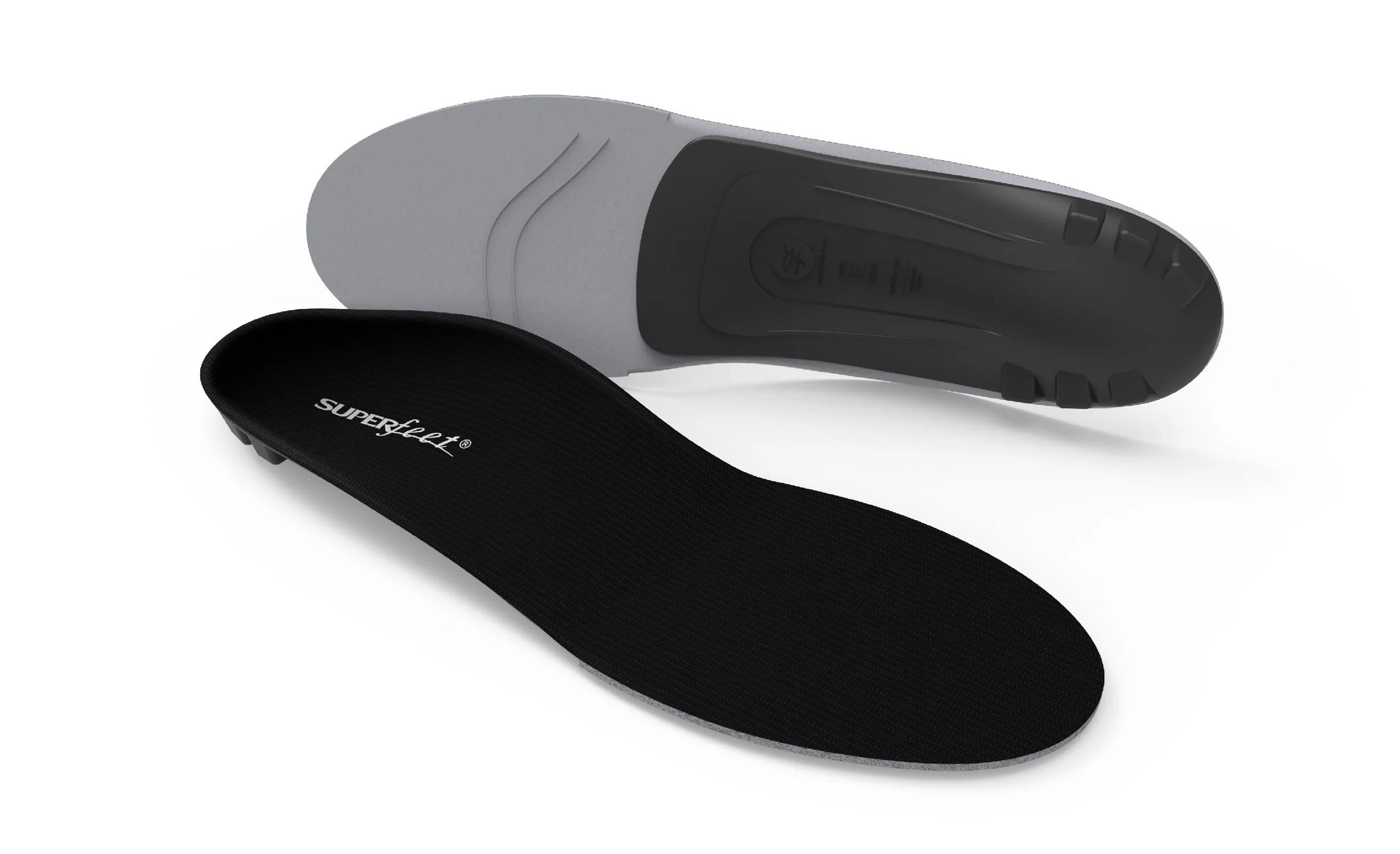 Black and gray shoe insoles on a white background